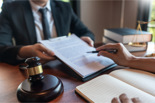 A judge holding a document.