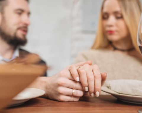 A man and woman holding hands.